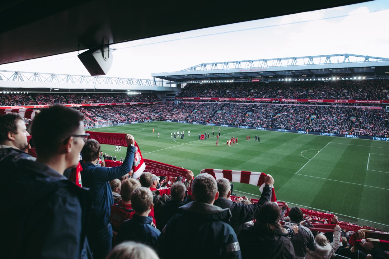 crowd cheering at Anfield stadium